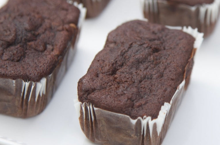 Freshly baked chocolate zucchini bread in a mini loaf